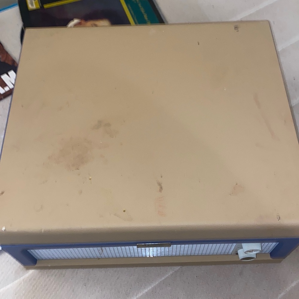 This is a blue Crosley Dansette Jr Portable Record player